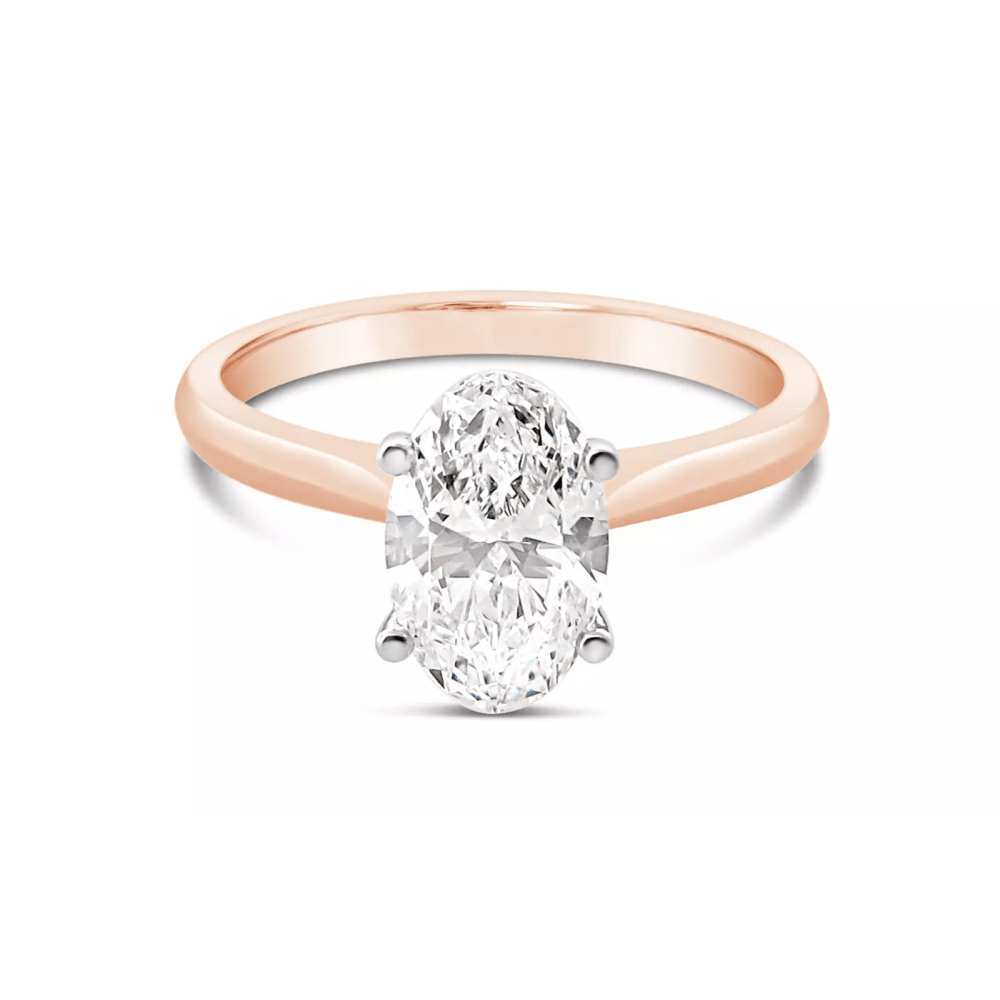 A simple rose gold oval cut diamond engagement ring.