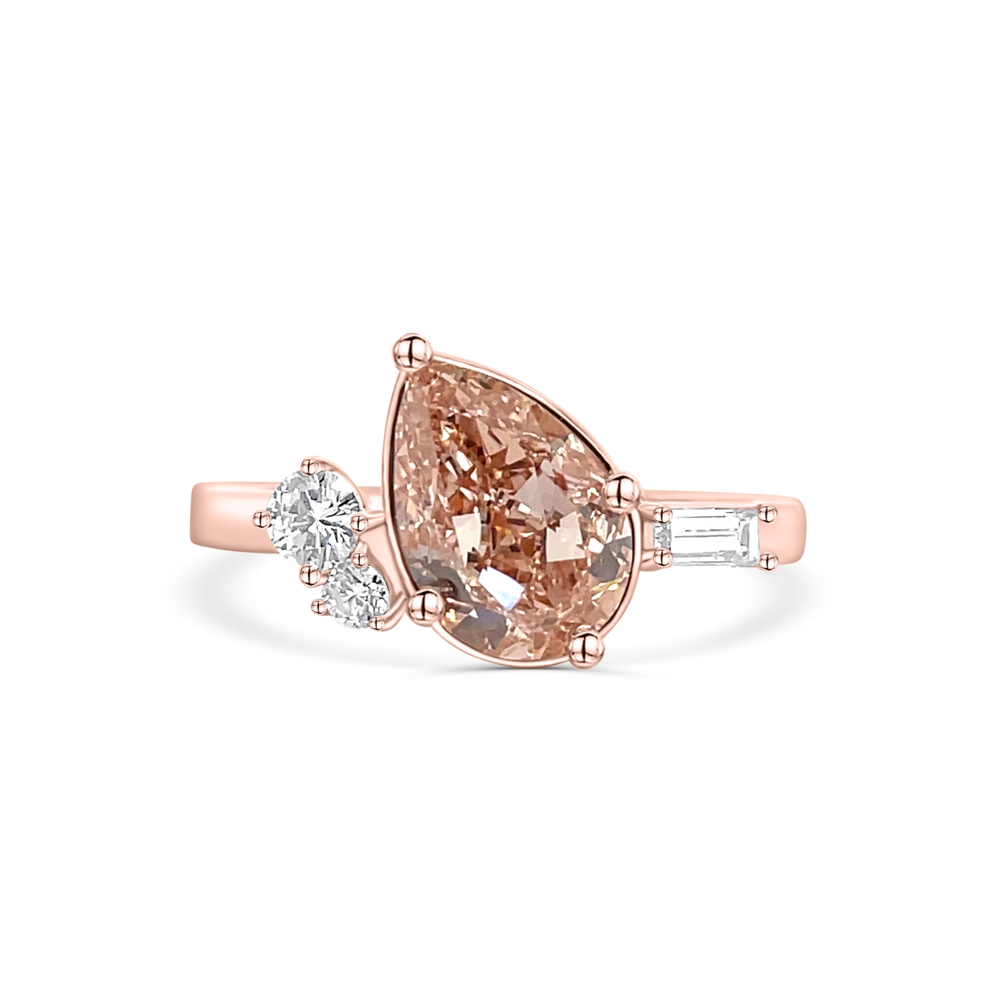 Unique custom Rose Gold Ring with a Brown Pink pear diamond, two round diamonds and a baguette diamond.